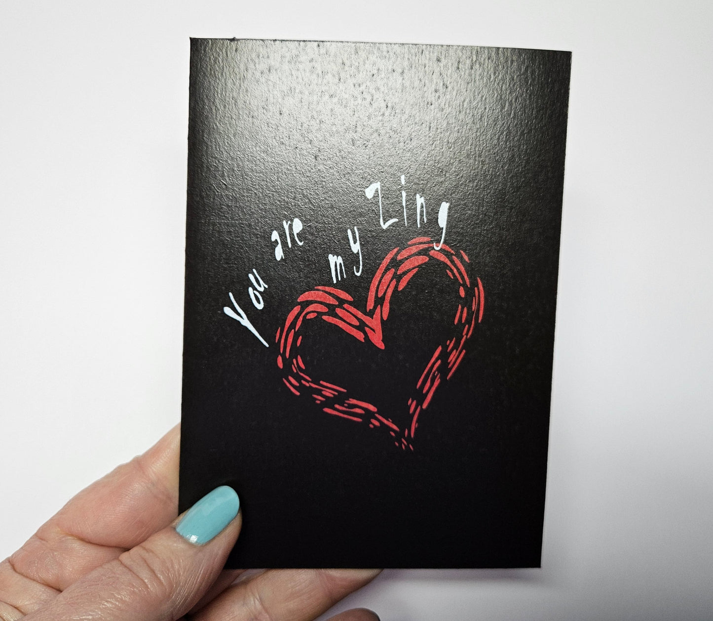 You are My Zing Greeting Card printed on black cardstock. With a bright red envelope in a biodegradable acetate sleeve. Size A6. Digital design