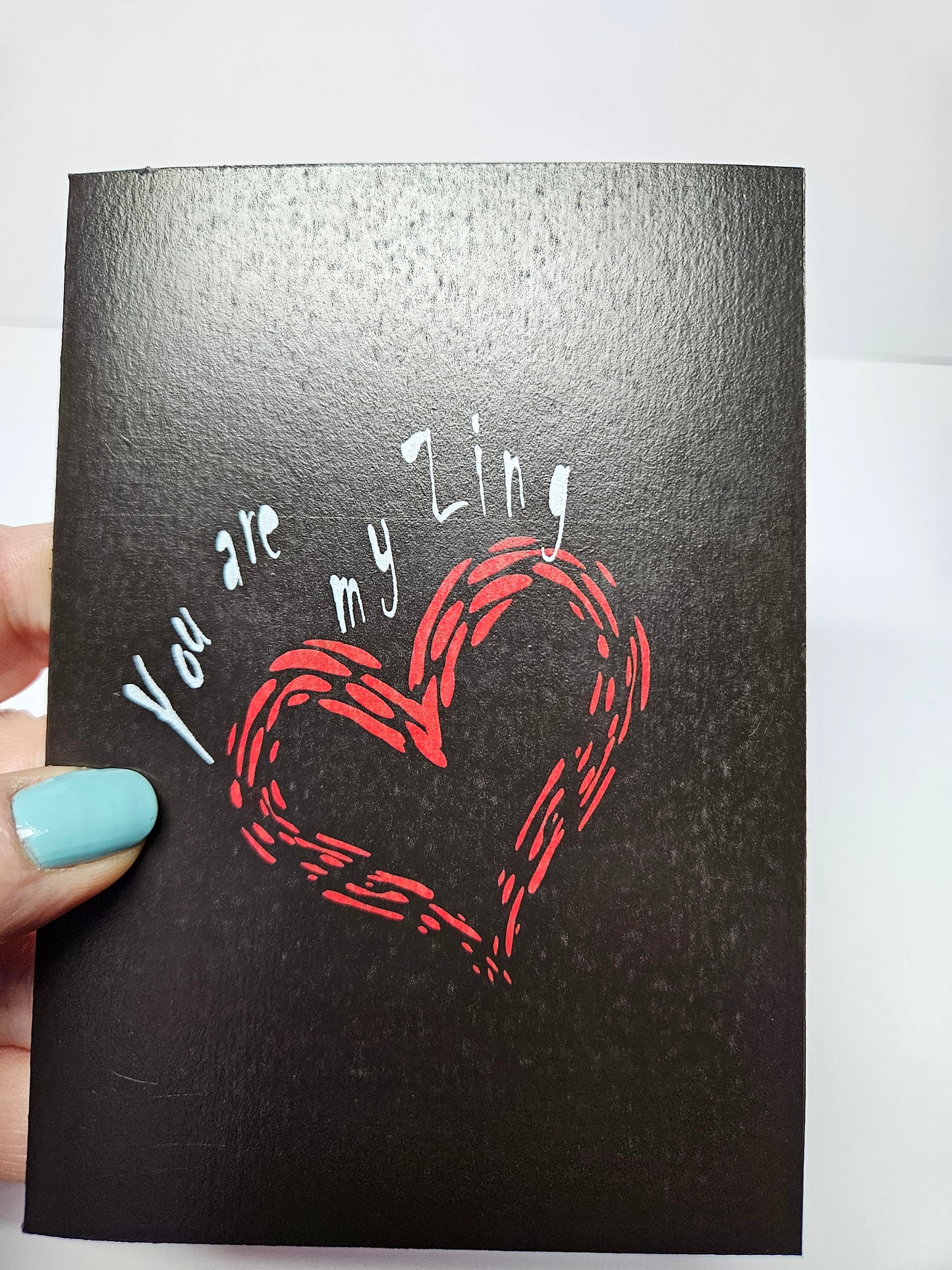 You are My Zing Greeting Card printed on black cardstock. With a bright red envelope in a biodegradable acetate sleeve. Size A6. Digital design