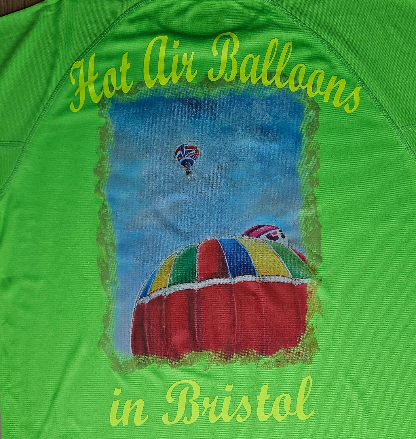 Lime Green. T-Shirts with Hot Air Balloons in Bristol Graphics for Adults. High quality sport Aircool Tees. Lime Green colour.