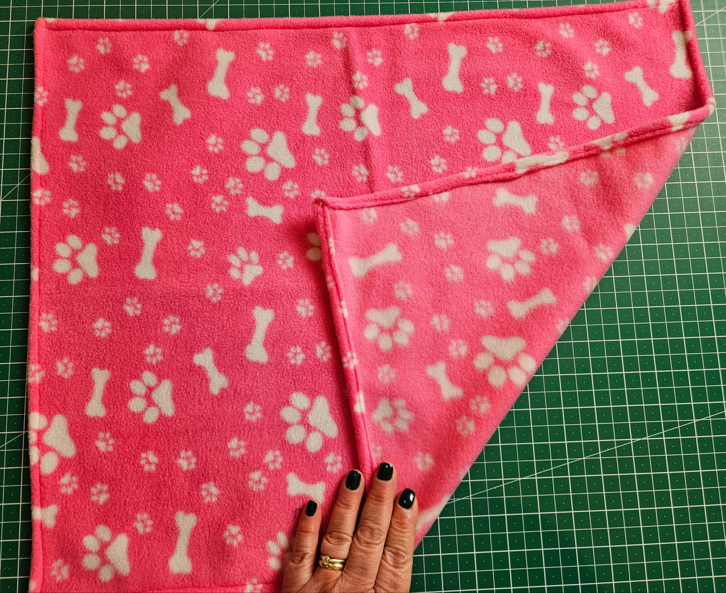 Little Pet Blanket. Dog theme Anti Pill Polar Fleece Fabric with paw and bones prints. Selection of pink or black background