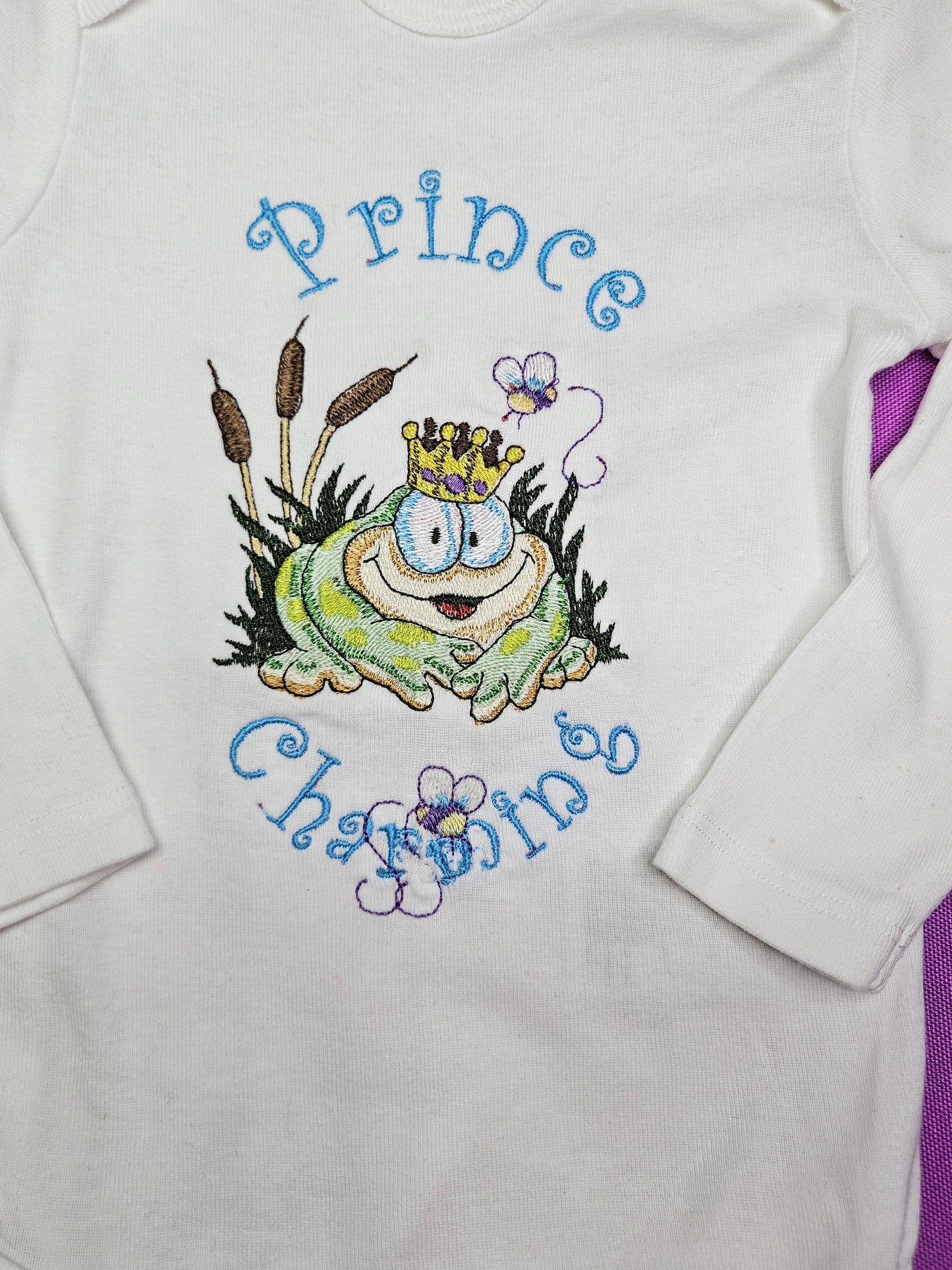 Prince Charming Froggy. Cute Design Embroidered on Organic Cotton Long and Short Sleeve Baby Bodysuit. Comfortable and soft.