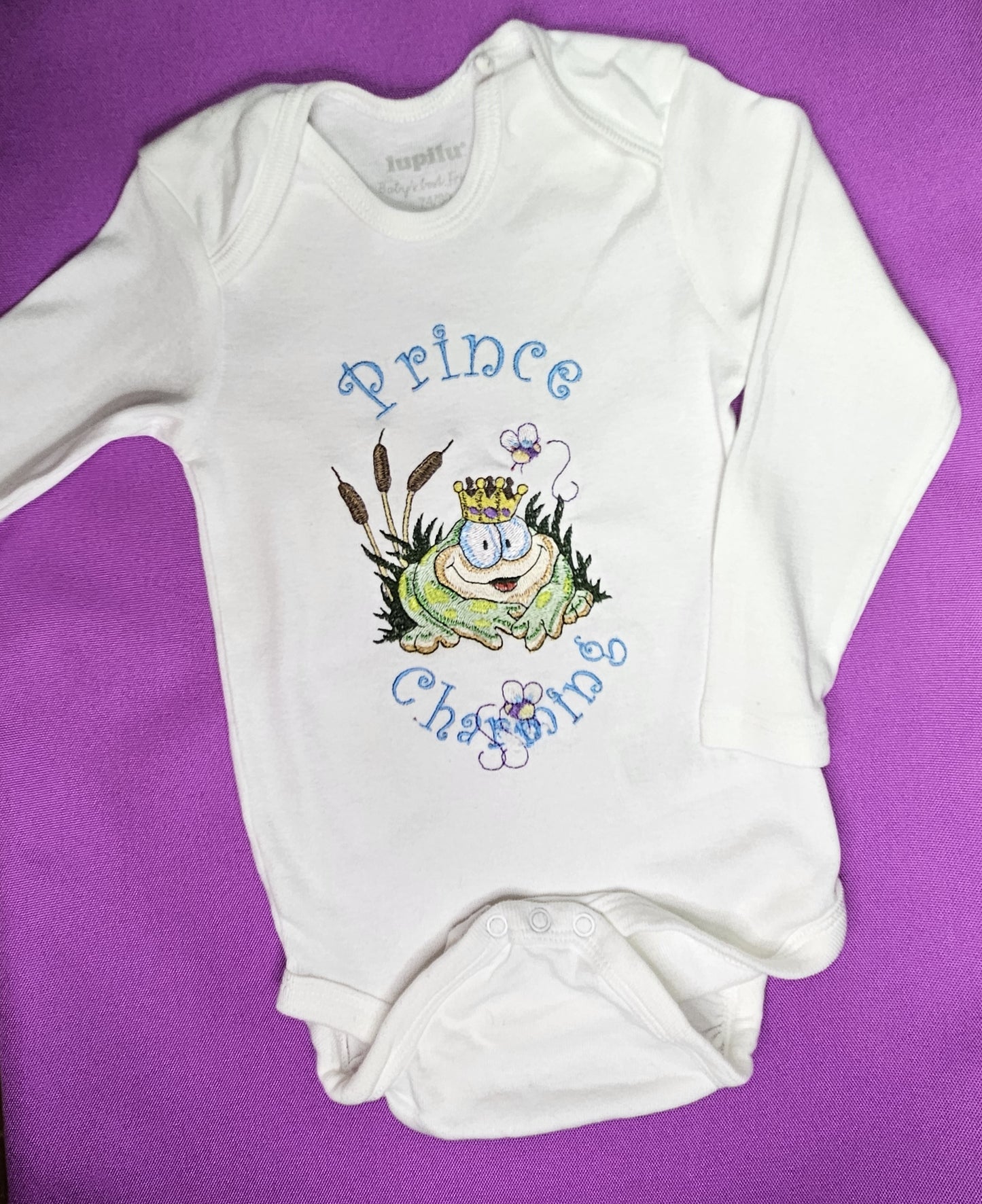 Prince Charming Froggy. Cute Design Embroidered on Organic Cotton Long and Short Sleeve Baby Bodysuit. Comfortable and soft.