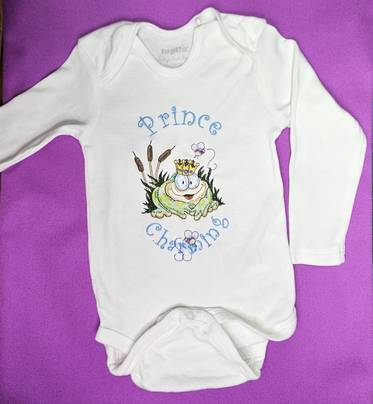 Prince Charming Froggy. Cute Design Embroidered on Organic Cotton Long and Short Sleeve Baby Bodysuit. Comfortable and soft.