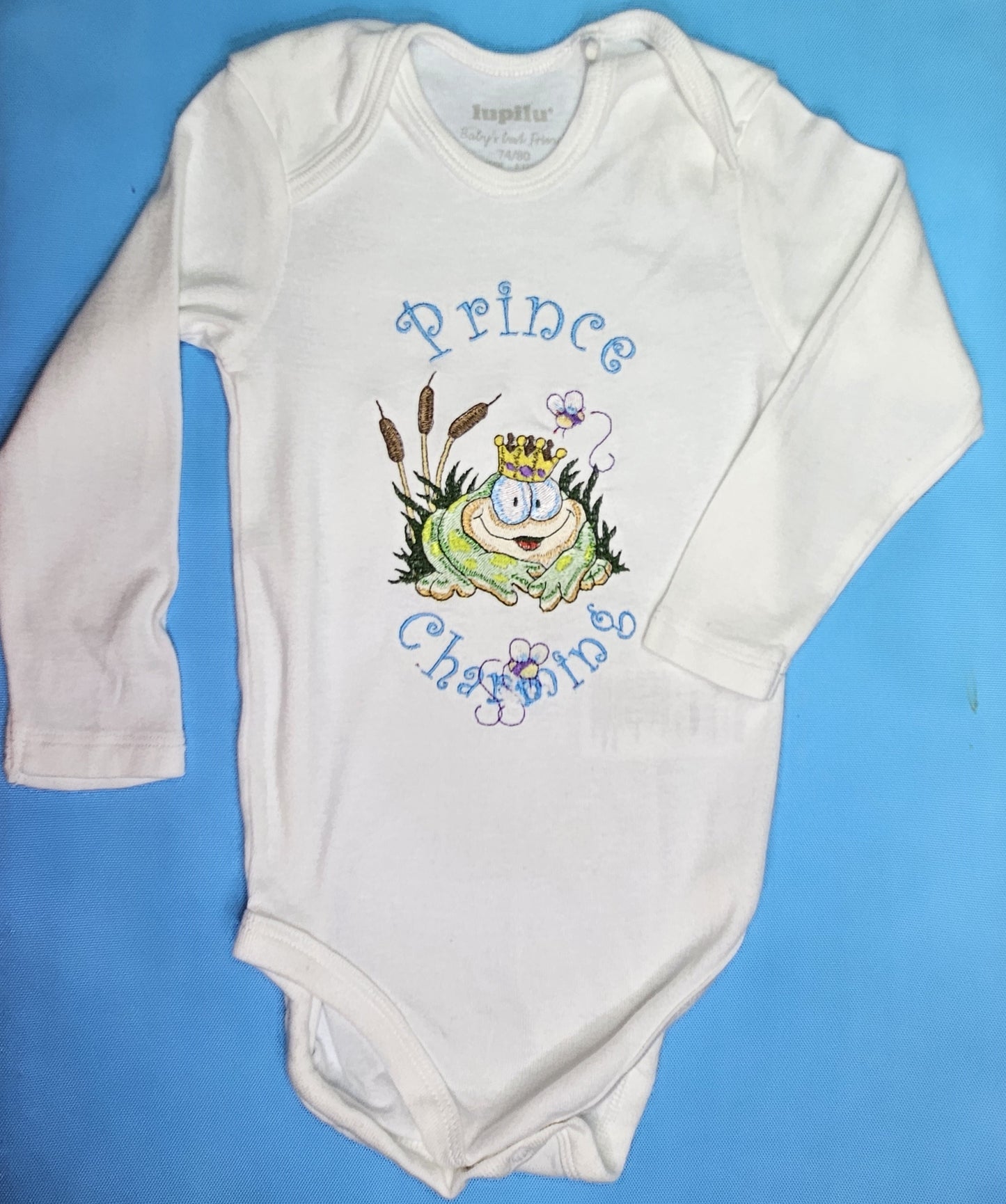 Prince Charming Froggy. Cute Design Embroidered on Organic Cotton Long and Short Sleeve Baby Bodysuit. Comfortable and soft.