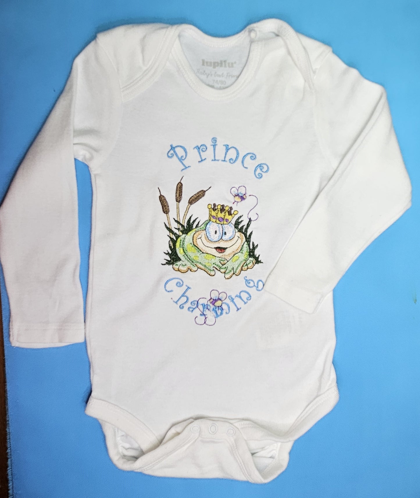 Prince Charming Froggy. Cute Design Embroidered on Organic Cotton Long and Short Sleeve Baby Bodysuit. Comfortable and soft.