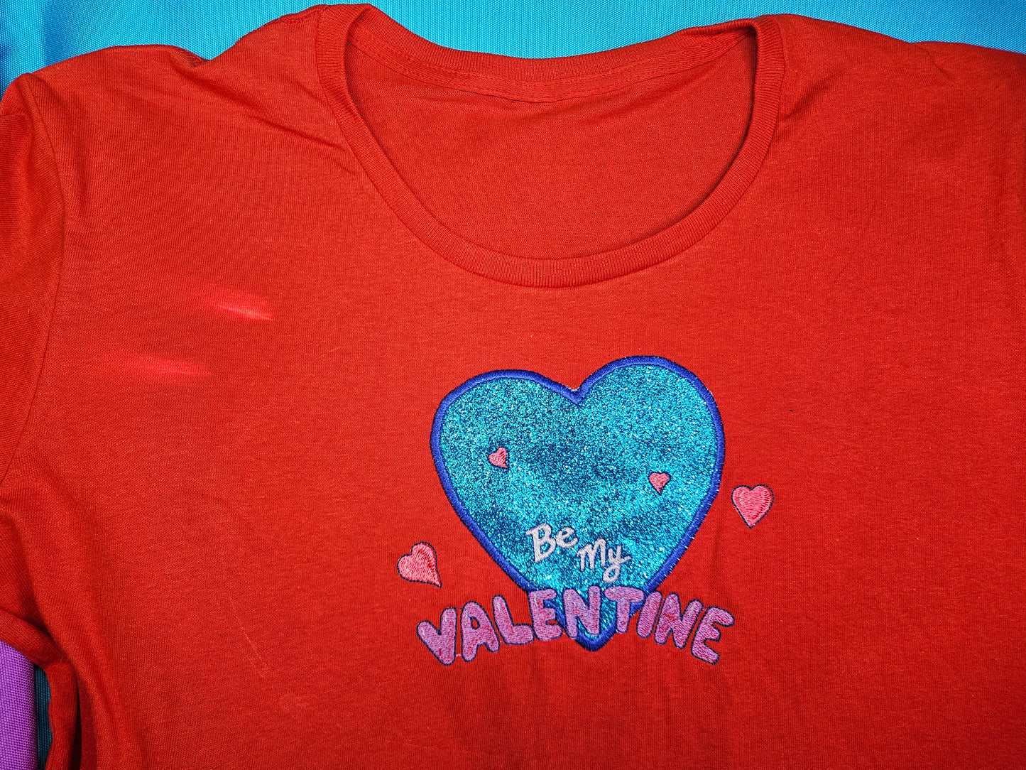 Be My Valentine design embroidered on Red T-Shirt. Comfortable, soft Tees for Toddlers, Youth and Adults.