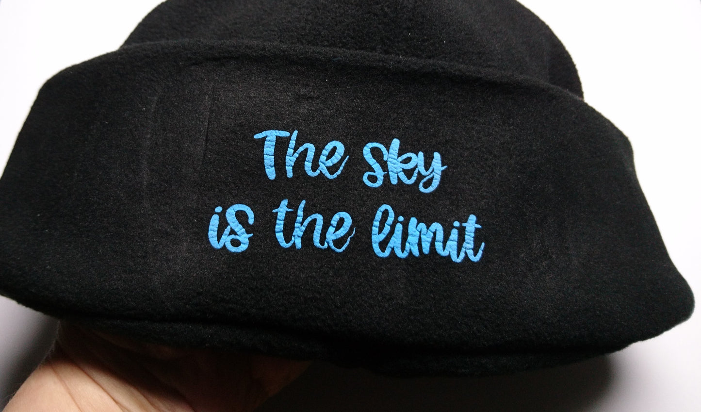 3D- Puff Glow in The Dark. Green Neon Vinyl on Black Supra Fleece Ski Hat with the quote "The Sky is the Limit". Comfy, Warm, Sport. One Size.