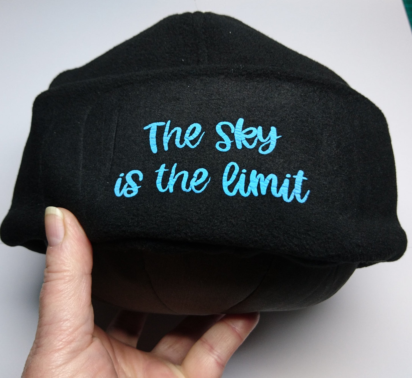 3D- Puff Glow in The Dark. Green Neon Vinyl on Black Supra Fleece Ski Hat with the quote "The Sky is the Limit". Comfy, Warm, Sport. One Size.