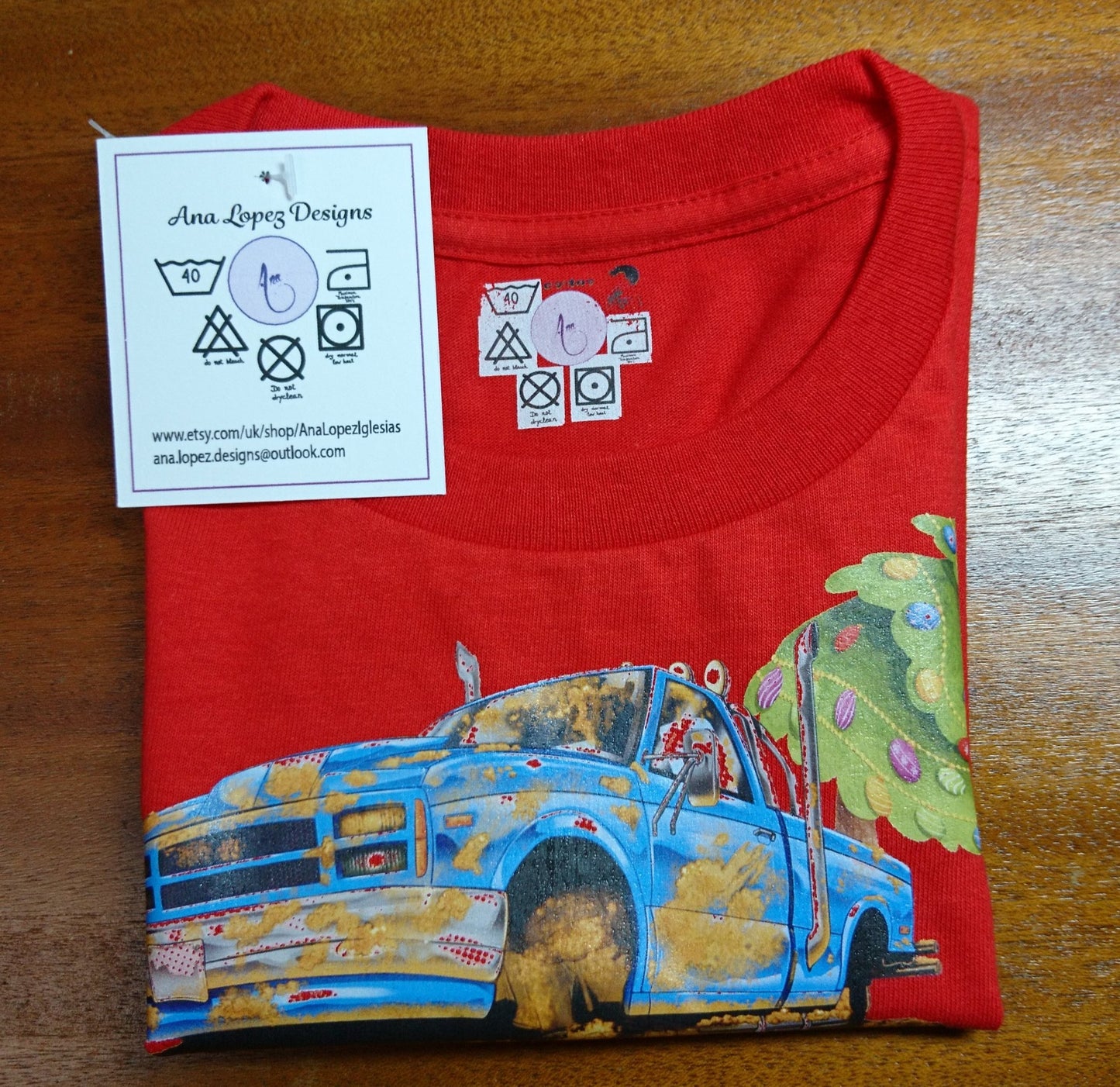 T-Shirts with the print of The Muddy Monster Truck carrying a Christmas Tree. Comfortable, soft Tees for Toddlers, Youth and Adults.