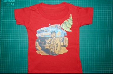 T-Shirts with the print of The Muddy Monster Truck carrying a Christmas Tree. Comfortable, soft Tees for Toddlers, Youth and Adults.