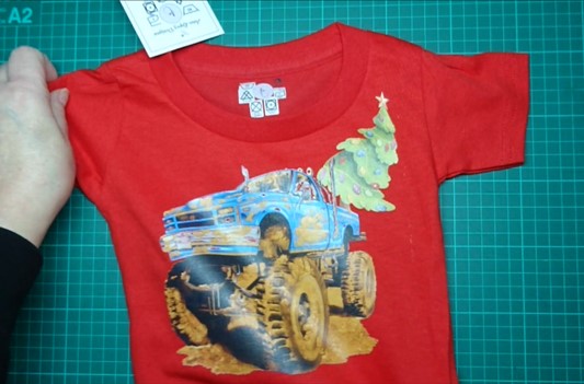 T-Shirts with the print of The Muddy Monster Truck carrying a Christmas Tree. Comfortable, soft Tees for Toddlers, Youth and Adults.