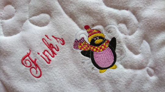 Personalised Pet Christmas Penguin Blanket. Handmade, Quilted and Double sided, with wadding in for more comfort. Penguin and pet's name embroidered.