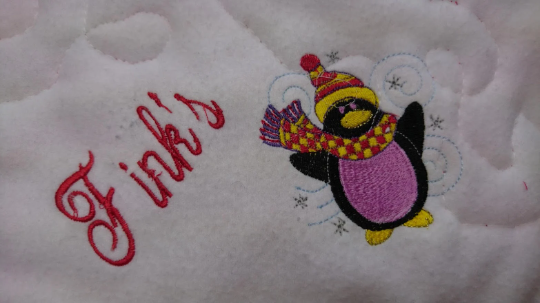 Personalised Pet Christmas Penguin Blanket. Handmade, Quilted and Double sided, with wadding in for more comfort. Penguin and pet's name embroidered.