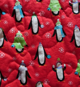 Personalised Pet Christmas Penguin Blanket. Handmade, Quilted and Double sided, with wadding in for more comfort. Penguin and pet's name embroidered.